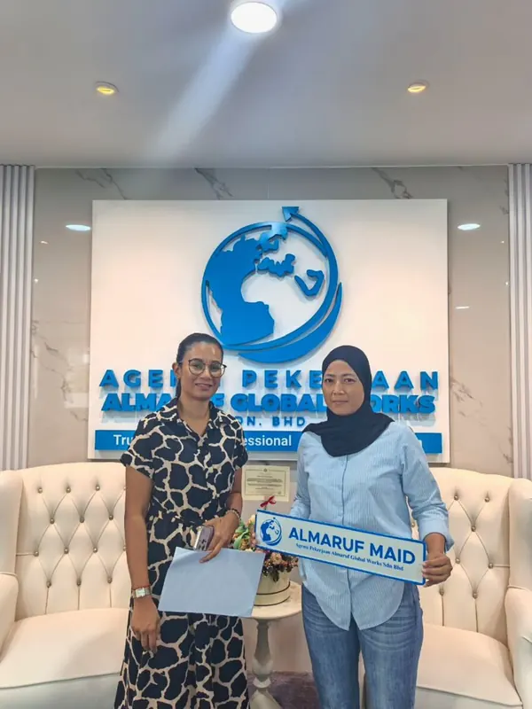 An employer with their new Almaruf helper on handover day